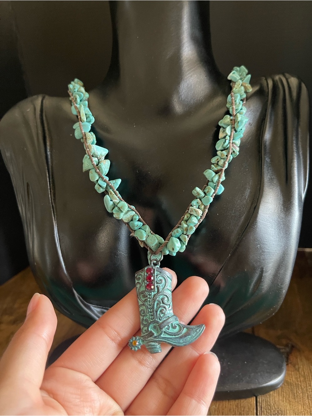Turquoise western boot necklace with a silver tone extender.